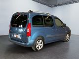 a blue van that is parked in a garage