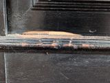 a close up of a piece of wood sticking out of a door