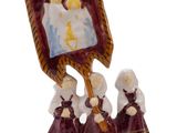 a figurine of a group of people holding a flag