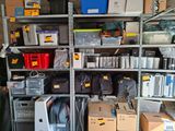 many boxes and boxes on the shelves in the garage
