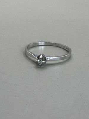 an image of a diamond ring on a table