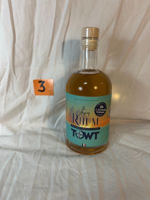 a bottle of liquor sitting on a table with a price tag