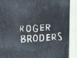 a black and white photo of roger broder ' s name on a black and white photo