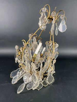a close up of a chandelier on a table with a black background