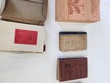 five boxes of books on a white table