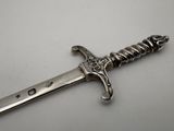 an image of a silver sword on a white surface