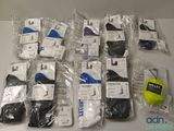 many pairs of men ' s socks and a tennis ball on the table