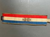 an image of a red, white, and blue ribbon with a lion on it