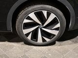 a close up of a car wheel on a carpeted floor