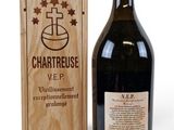 a bottle of wine sitting next to a wooden box