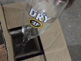 a person holding a wine glass in front of a box