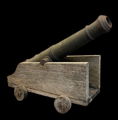 a wooden cart with a cannon on top of it