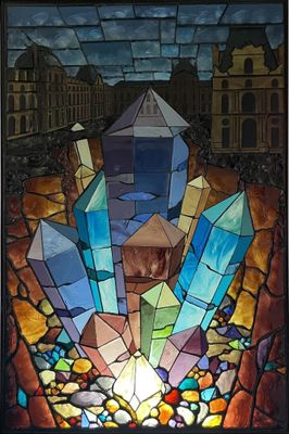 painting of a stained glass window with a building in the background