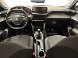 the interior of a car with a steering wheel, dashboard, and dashboard controls