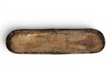 an old knife with a wooden handle sitting on a white surface