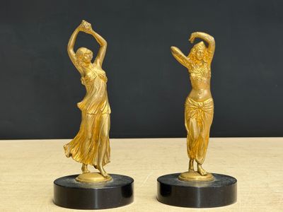pair of art deco bronze figurines of a woman and a man
