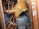 a small room with a bed and a chair in it