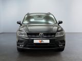 the front of a black volkswagen suv parked in a white room