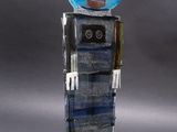 a sculpture of a robot made out of glass