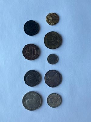 a lot of coins that are on the table