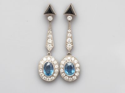 an image of a pair of blue and white diamond earrings