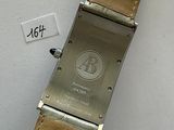 an image of a watch on a white surface with a price tag