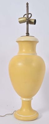 a yellow lamp that is sitting on a table
