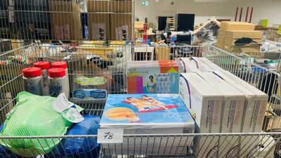 a shopping cart full of items in a store