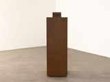 a sculpture that is standing in the middle of a room
