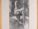 framed drawing of a woman sitting on a chair in a room