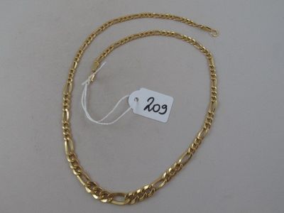 a close up of a gold chain with a price tag on it