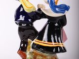a figurine of a man and a woman dancing