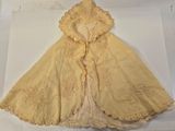 a picture of a yellow dress on display on a table