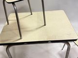 two chairs and a table on a white background