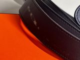 a belt that is laying on top of an orange box