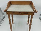 an image of a small wooden table with a marble top
