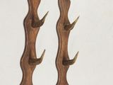 several pieces of wood are displayed on a white surface