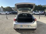 the back of a silver car with its trunk open in a parking lot