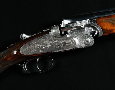 a close up of a gun on a black surface with a black background