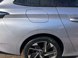 a silver car parked on the side of the road