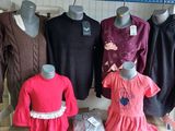 several mannequins and dresses are on display in a room