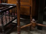 a small table with a mirror on it in a room