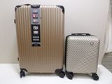 two pieces of luggage that are sitting on a table
