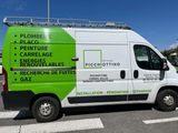 a green and white van that is parked in the parking lot