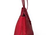 a red handbag on a white background with a white background