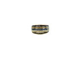 an image of a ring with blue and white diamonds on a white background