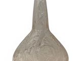a glass vase that is sitting on a white surface