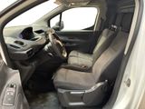 the interior of a car with the door open and the driver ' s seat down