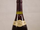 a bottle of wine that is sitting on a table