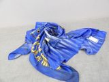 a blue scarf that has a gold design on it